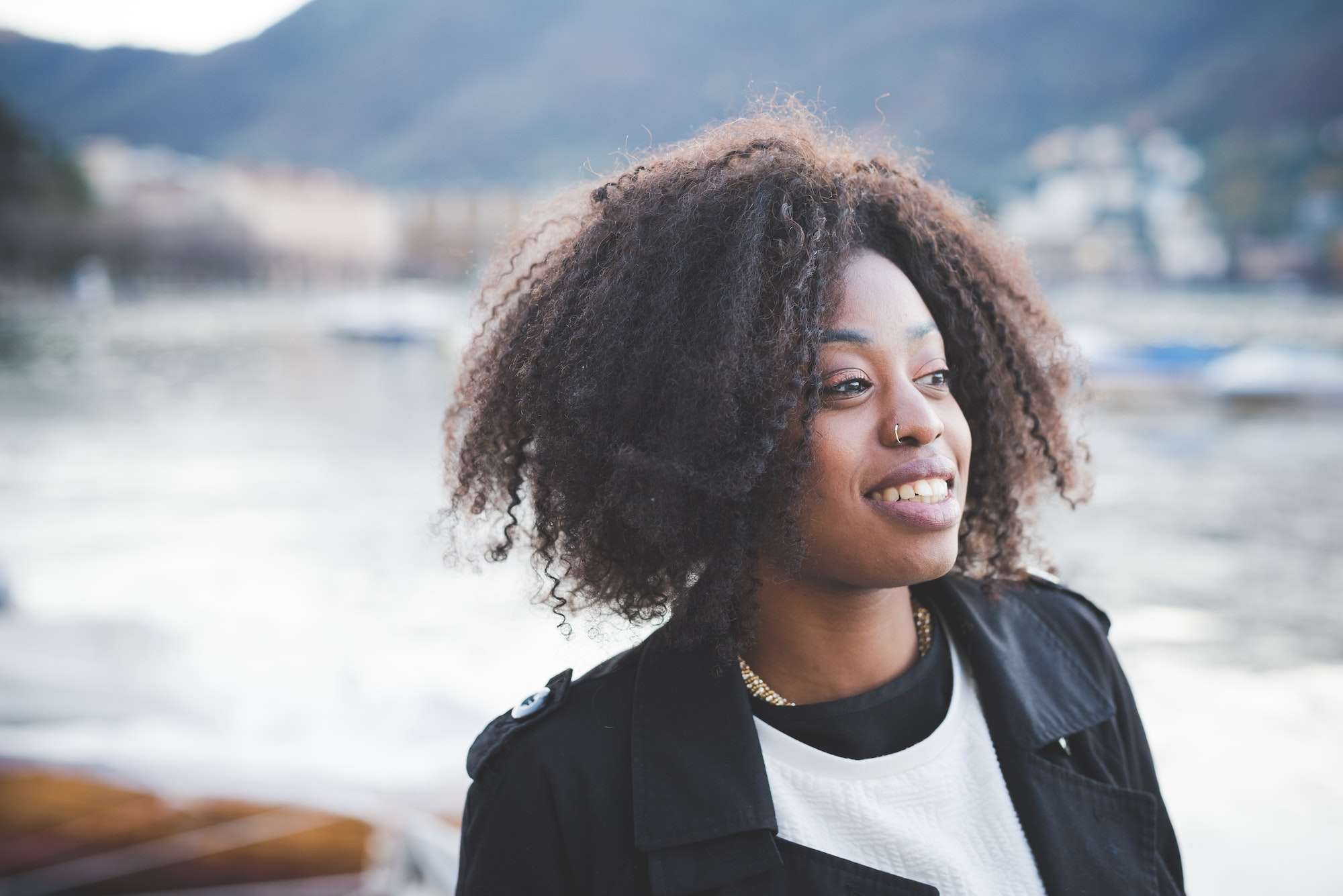 Portrait of smiling young woman at Lake Como, Como, Italy